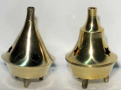 Two brass incense burners on a white background