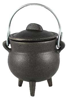 Black cast iron cauldron with lid on a white background