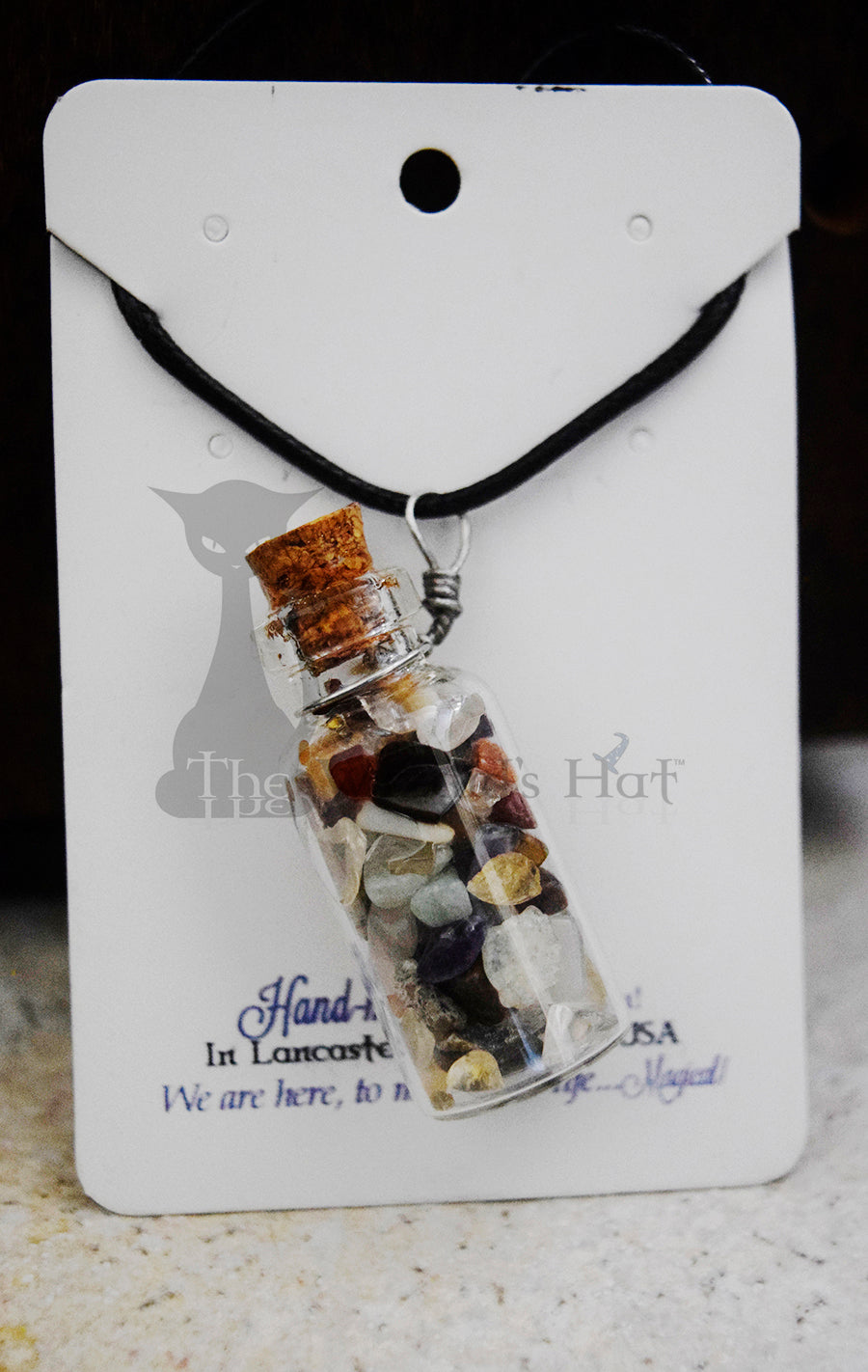 Mixed Gemstones, glass bottle with cork necklace.